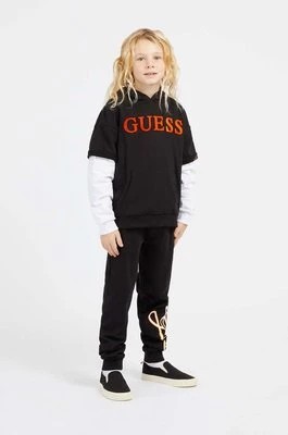 Zdjęcie produktu Guess bluza bawełniana dziecięca kolor czarny z kapturem wzorzysta