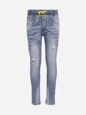 Zdjęcie produktu Jasnoniebieskie Jeansy z Przetarciami i Dziurami Wykończone Gumką w Pasie Salicaria