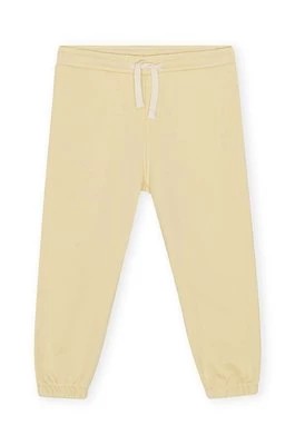 Zdjęcie produktu Konges Sløjd spodnie dresowe dziecięce kolor żółty gładkie