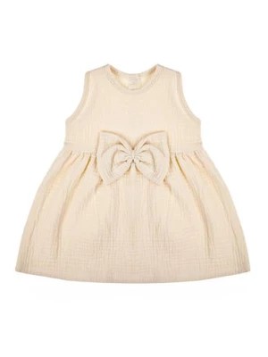 Zdjęcie produktu Muślinowa sukienka na ramiączkach dla dziewczynki w kolorze beżowym Nicol