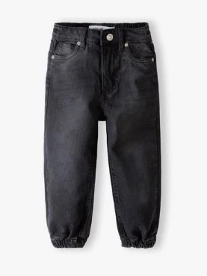 Zdjęcie produktu Spodnie jeansowe typu joggery dziewczęce - czarne Minoti