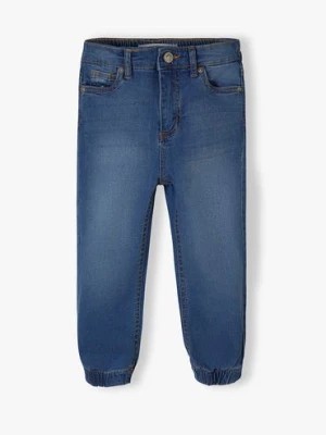 Zdjęcie produktu Spodnie jeansowe typu joggery dziewczęce Minoti