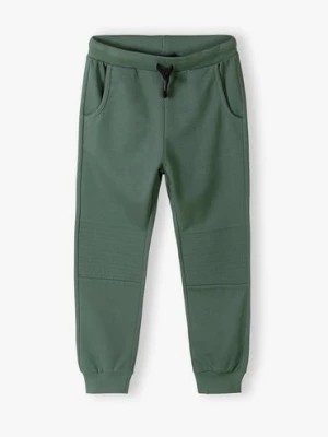 Zdjęcie produktu Bawełniane spodnie dresowe regular fit dla chłopca - khaki 5.10.15.