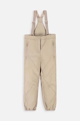 Zdjęcie produktu Coccodrillo spodnie do sportów zimowych dziecięce kolor beżowy