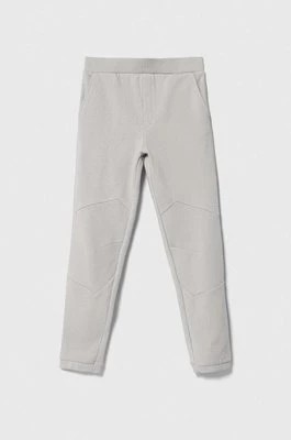 Zdjęcie produktu Guess spodnie dresowe bawełniane dziecięce kolor szary z aplikacją