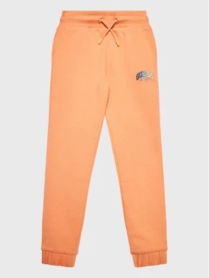 Zdjęcie produktu Guess Spodnie dresowe J3RQ11 KA6R0 Pomarańczowy Regular Fit