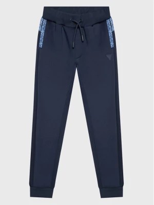 Zdjęcie produktu Guess Spodnie dresowe L3RQ15 JR06W Niebieski Relaxed Fit