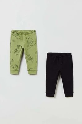 Zdjęcie produktu OVS spodnie dresowe bawełniane dziecięce kolor zielony wzorzyste