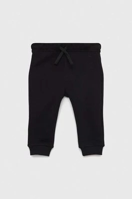 Zdjęcie produktu United Colors of Benetton spodnie dresowe bawełniane dziecięce kolor czarny gładkie