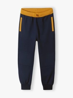 Zdjęcie produktu Granatowe spodnie dresowe dla chłopca 5.10.15.